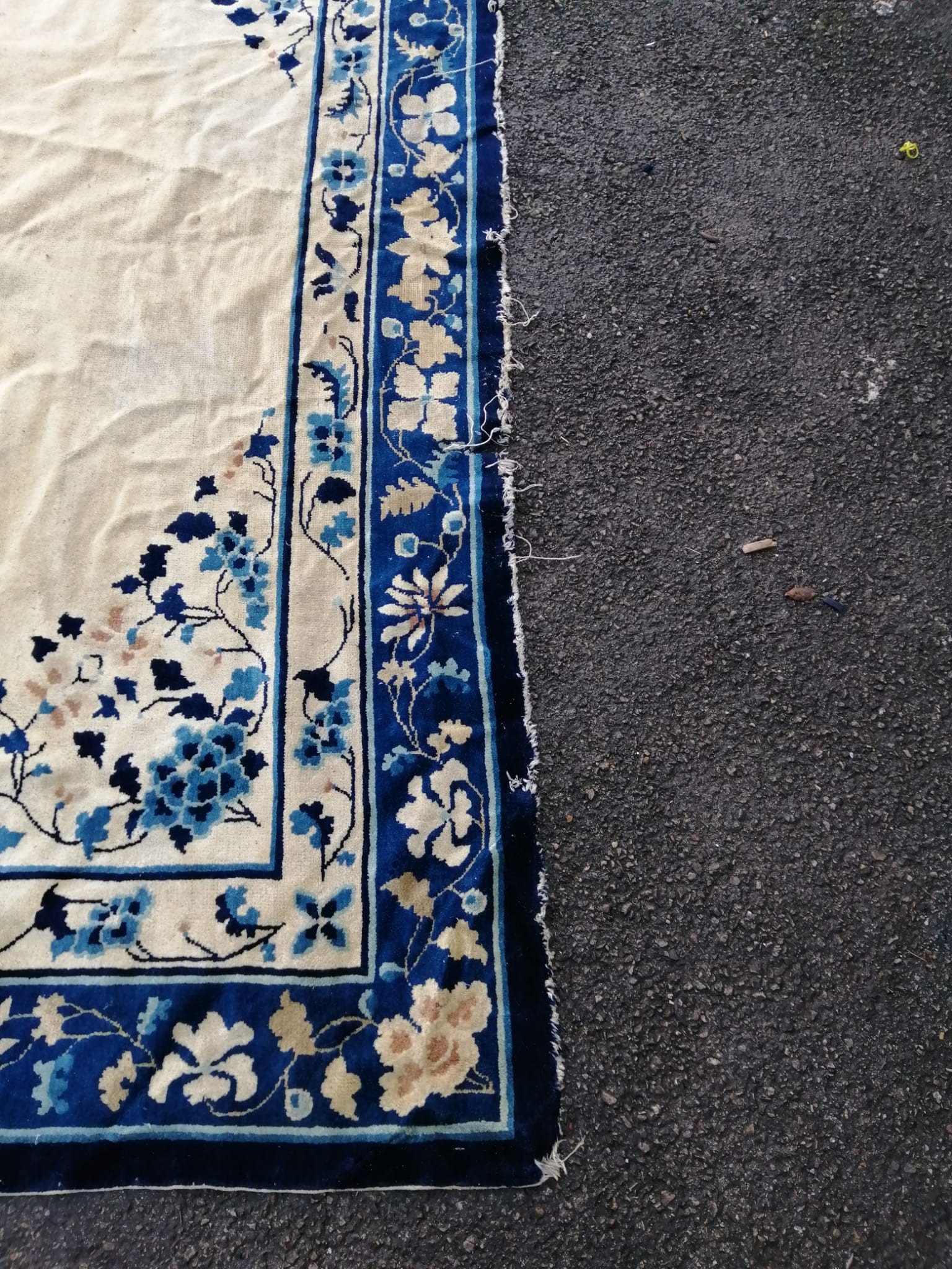 A Chinese ivory ground carpet, 320 x 240cm